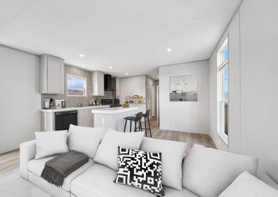 Model living room with sofa at Cedar Ridge Manufactured Homes in Wichita Kansas