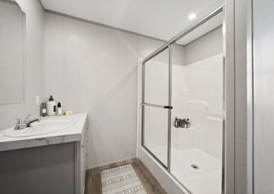 Model bathroom with large walk in shower at Cedar Ridge Manufactured Homes in Wichita Kansas